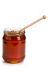Jar full of honey and stick