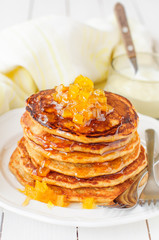 A Stack of Pumpkin Pancakes Topped with Pumpkin Preserves