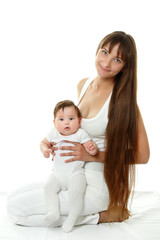 happy young mother with cute smiling baby over white