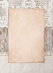 Aged paper and linen fabric on the old wood