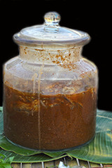 Fish pickled in jars in the market.
