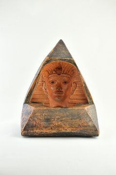 figure of pyramid and faraon face