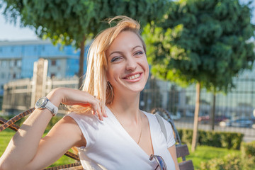 blond 20s female in city park day