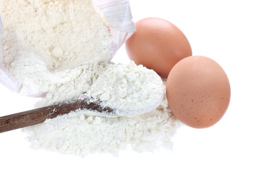 Fototapeta na wymiar Flour and eggs on white background