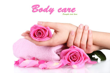 Pink towel with roses and hands isolated on white