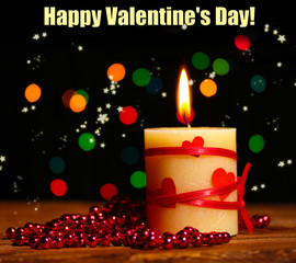 Beautiful candle on wooden table on bright background