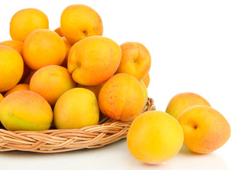 Fresh natural apricot in wicker basket isolated on white
