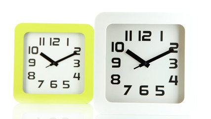 Fototapeta premium Two office clocks, isolated on white