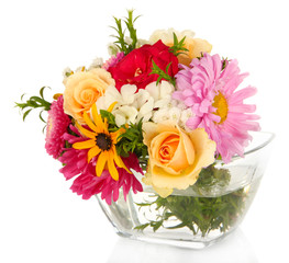 Beautiful bouquet of bright flowers in glass vase, isolated