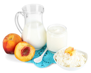 Fresh dairy products with peaches isolated on white