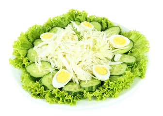 Delicious salad with eggs, cabbage and cucumbers, isolated