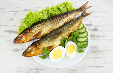 Smoked fish on plate close up
