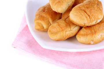 Tasty croissants on plate close-up