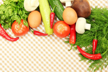 Obraz na płótnie Canvas Cooking concept. Vegetables on tablecloth background