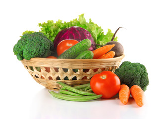 Different vegetables in basket isolated on white