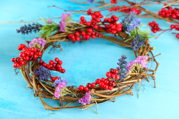Wreath of dry branches with flowers and viburnum
