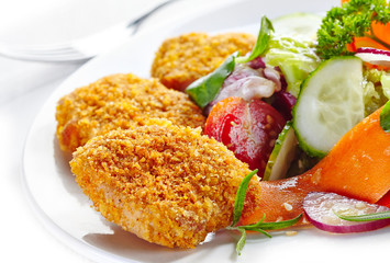 chicken nuggets and vegetable salad