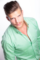 casual man looks up at camera