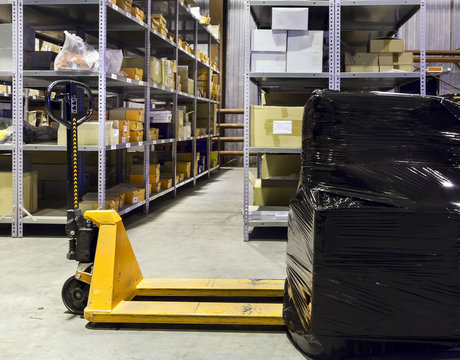 Forklift on large warehouse