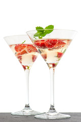 strawberry cocktail with berry in martini glass isolated on whit