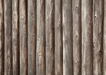 Old brown wooden wall of rural house made of logs