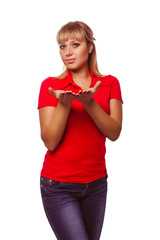 Fototapeta premium young happy blond woman showing open hand holding red T-shirt an