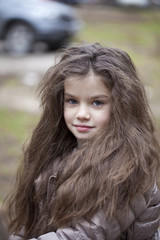 Naklejka premium Autumn portrait of a beautiful little girl