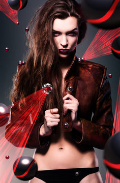 pretty erotic devil woman in leather jacket with laser lights