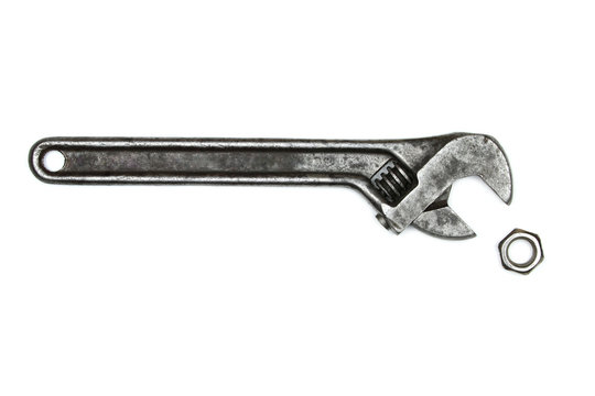 Old monkey wrench and bolt nut,  isolated on white background