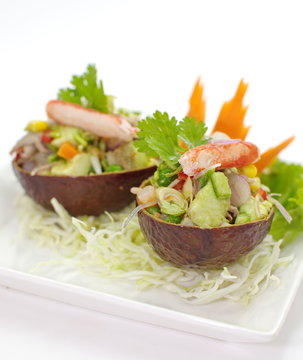 spicy salad with avocado and seafood