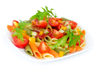 Colorful pasta on a white plate