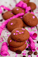 fresh chocolate cookies, coffee beans, pink ribbons and confetti