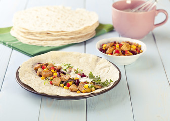tortilla wraps with meat and vegetables