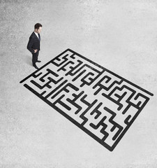 businessman looking at maze