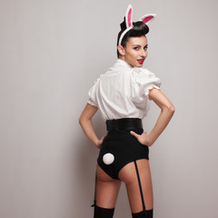 Pinup styling girl posing in vintage bunny costume