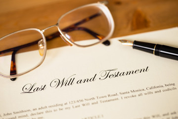 Last will and testament with pen and glasses concept for legal d