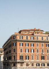 Fototapeta na wymiar Old Brown Stucco Apartment Building in Rome