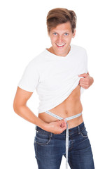 Man Measuring His Waistline