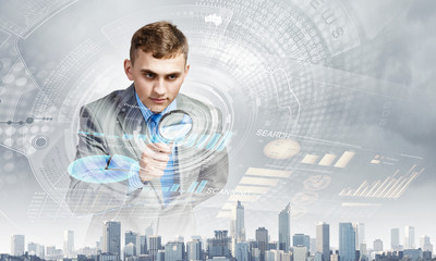 Man looking in magnifier