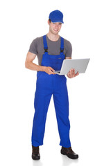 Mechanic Holding Laptop