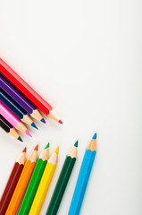 Fototapeta premium Wooden color pencils on white background