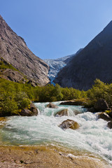 Fototapeta na wymiar Waterfall near Briksdal glacier - Norway
