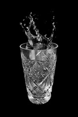 Glass of water and splashes