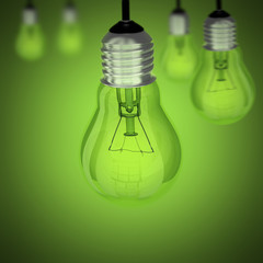Turned off light bulb on green background