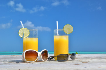 Sunglasses and orange juice