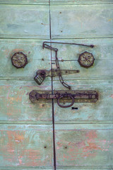 Strange and complicated lock of an old wooden door