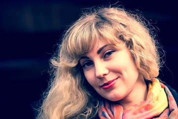 Portrait of a young girl in the autumn park