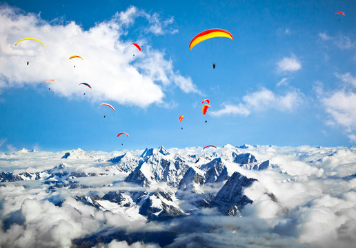 Paraglider flying against the Himalayas-Everest region, Nepal