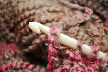 White Plastic Crochet Hook with Yarn