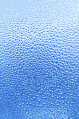 Natural water drops on glass